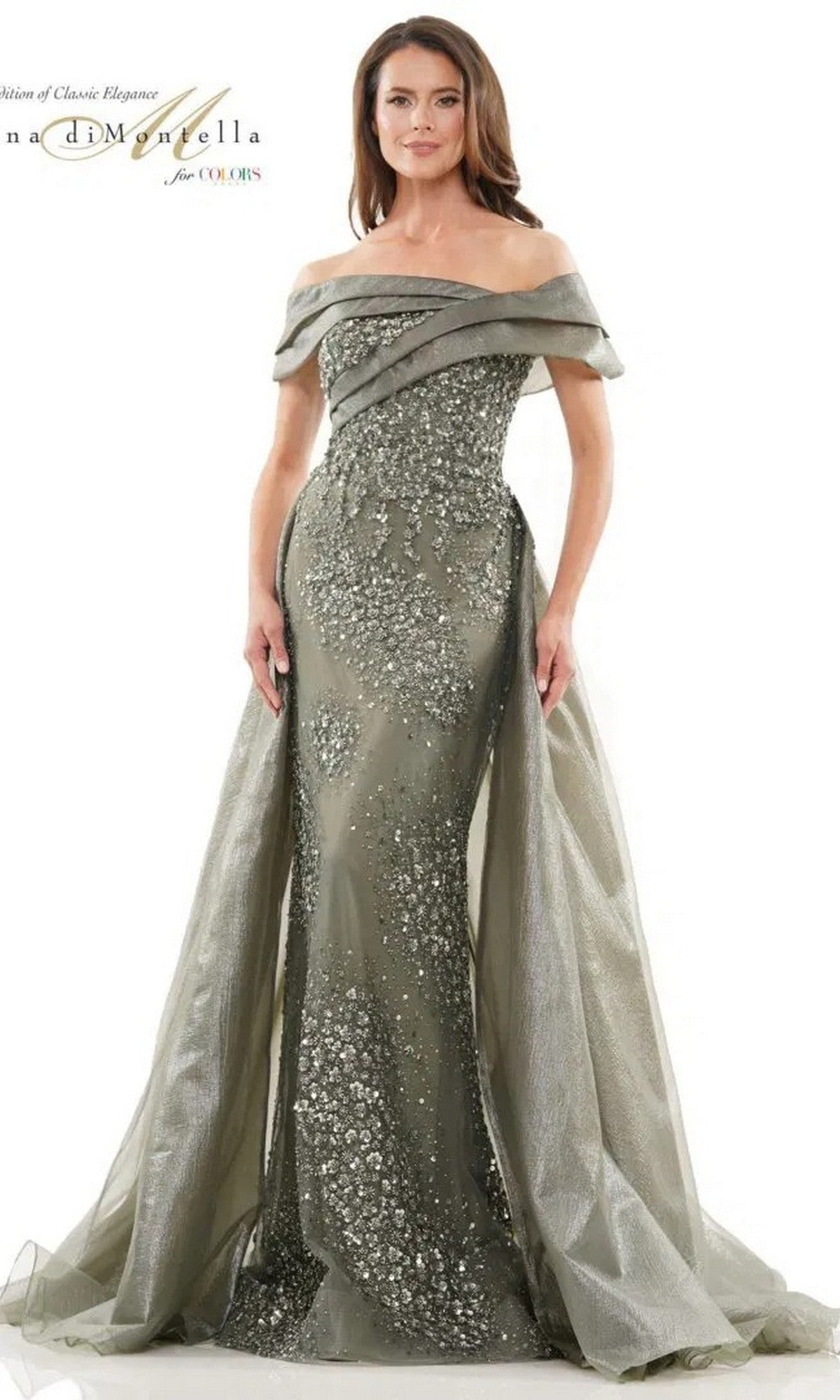 A woman wears the Rina Di Montella RD2816, a celadon long formal dress featuring an off-the-shoulder design, sparkling embellishments, floor-length silhouette, and a sheer cape detail.